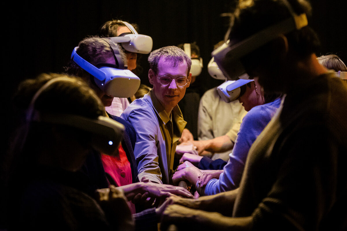 Frank&Robbert Robbert&Frank, *[WOOD](\artworks\7282767b-0d7f-486f-a417-738cb52fe8cf)* (2025). Scene from the international premiere of *[Wood – Table Dialogues](\exhibitions\1279d810-1a51-42e2-9ff6-b1aa4aa1a6a6)* at [internationales figuren.theater.festival](\institutions\90c9e326-ff0d-4964-9255-08de890ba785), Erlangen, Germany: Photo of the 'dragging the audience outside the virtual cave' scene.