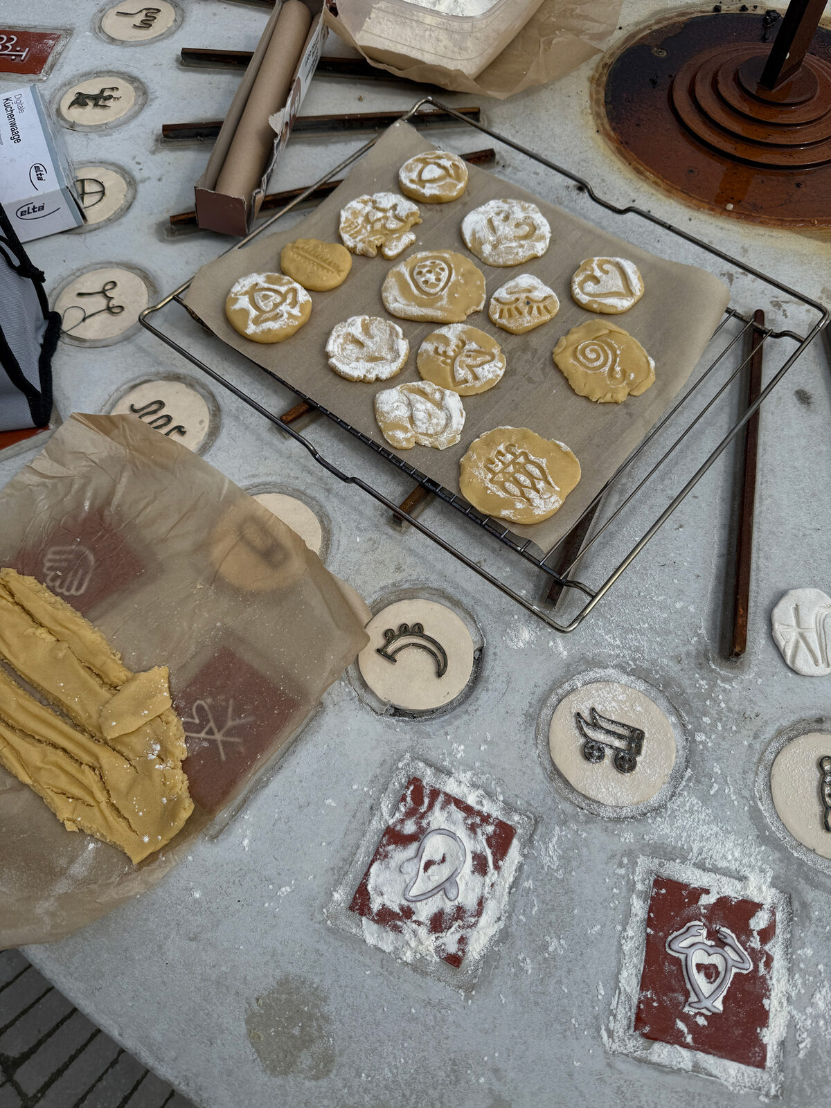 Frank&Robbert Robbert&Frank, *[Mandorla](\artworks\c8c03b4d-0e55-4632-901c-08de8728affe)* (2024 - 2025). Activation of the site-specific installation during the annual summer festivities, August 28, 2025: bread dough imprinted with sundial motifs to produce personalized cookies and hot dogs.