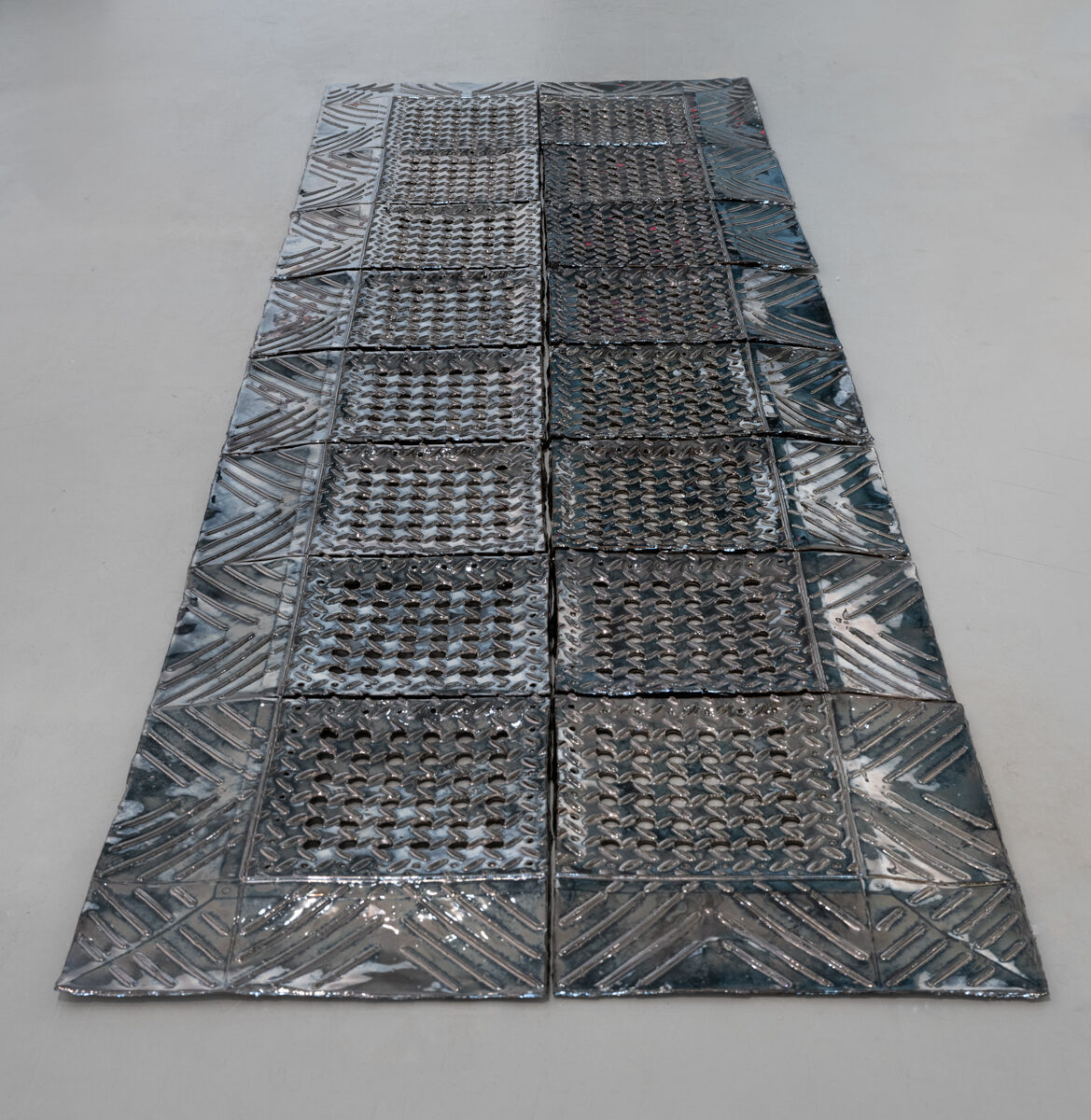Abed Elmajid Shalabi, *[Diamond Flex-Lok industrial mat with holes](\artworks\02ac3158-801d-4a80-ae5c-08dec0513e6d)* (2022)