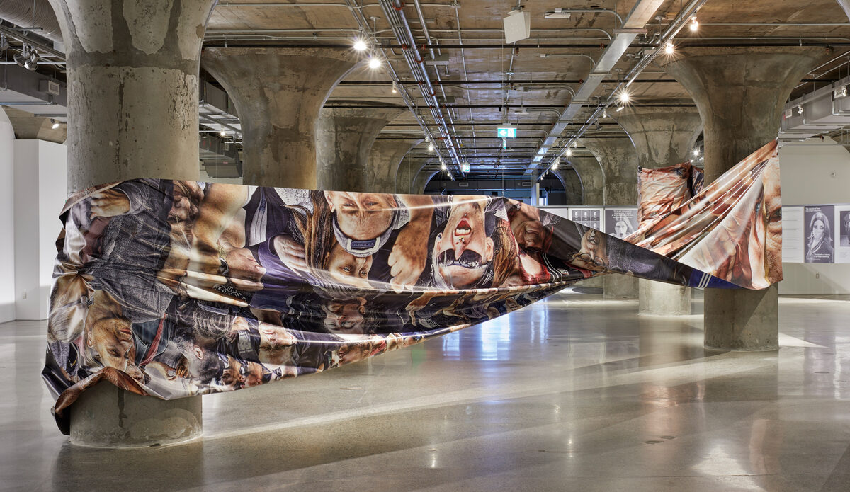 Satoshi Fujiwara, *[Crowd Landscape](\artworks\b44068d8-adee-4bb9-a1ac-08deaa6b6cd5)*, installation view in *[Age of You](\exhibitions\4a33cf67-5500-4ca2-0ca2-08dea67600b7)*, [Museum of Contemporary Art Toronto](\institutions\512e535f-b791-4854-0fd2-08dea687d3be), Toronto, 2019. Co-curated by [Shumon Basar](\people\07f15411-8746-48de-5bf2-08deaa62a1f3), [Douglas Coupland](\people\f99e3d0b-fb12-4d93-a9b1-08de3f2b66d8), and [Hans Ulrich Obrist](\people\c0abd490-8053-4334-f75a-08de041df6f5).