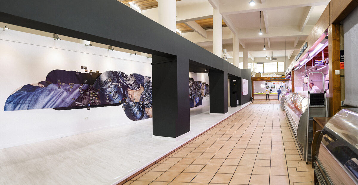 Satoshi Fujiwara, *[Friday Reports](\artworks\2081f915-c5bb-4615-506e-08dea6814a2a)*, 2025, installation view at a local market in Getxo, Spain, as part of *Rec.*, Getxophoto – International Image Festival, 2025.